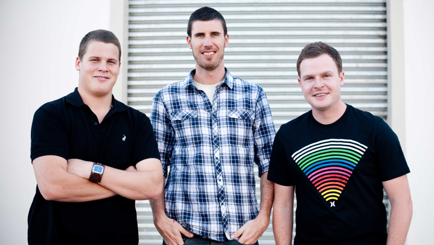 A photograph of WooThemes co-founders Adii, Magnus, and Mark.
