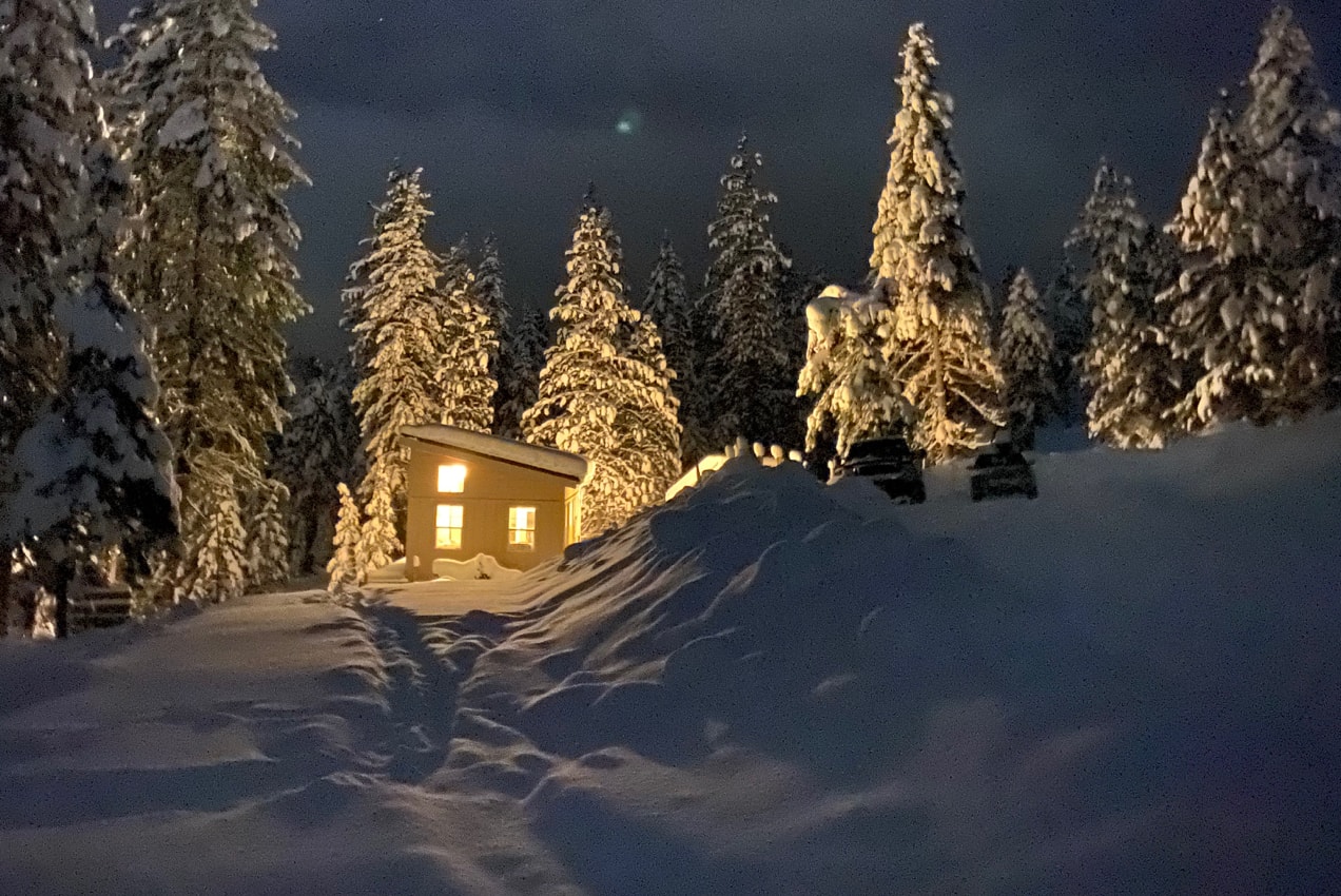 tiny house surrounded by snow