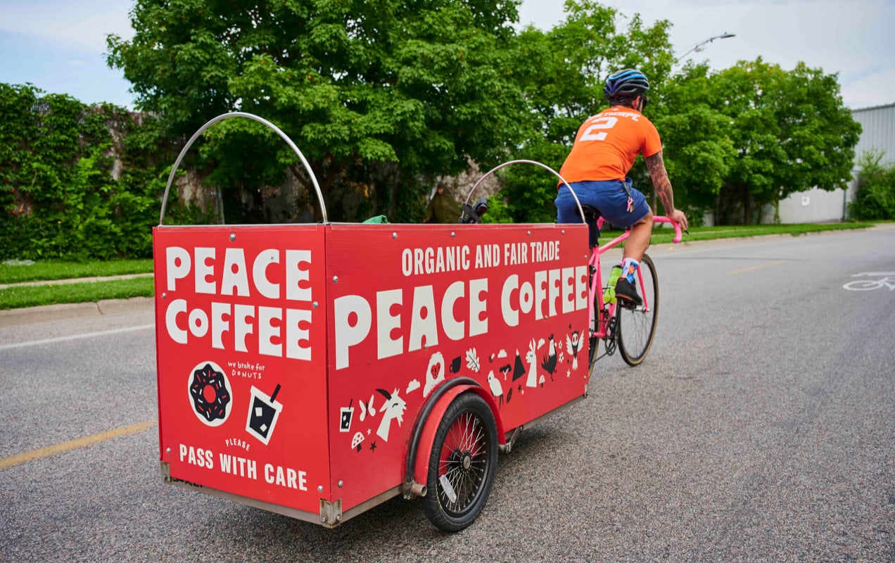Peace Coffee cart pulled by a biker