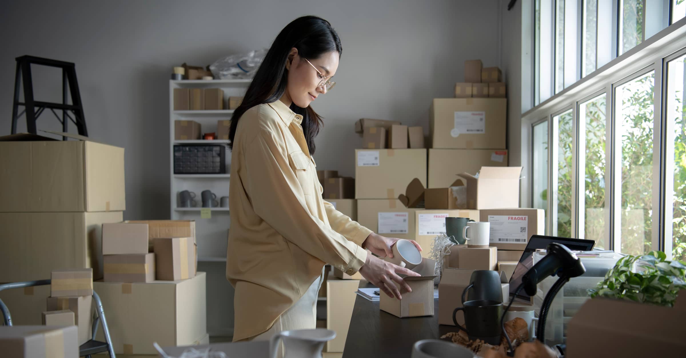 business owner packing items to ship